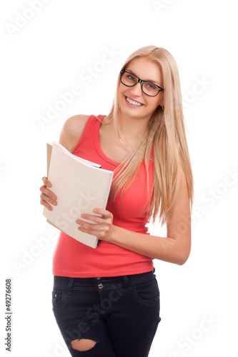 Photo: Student holding books Student holding books