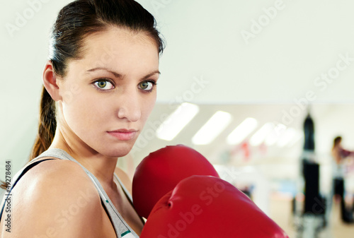 Photo: Boxer woman during boxing exercise Boxer woman during boxing exercise