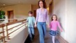 Mother With Two Kids Walk Alon...