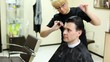 Video: Hairdresser cuts hair to man with long hair by scissors Hairdresser cuts hair to man with long hair by scissors