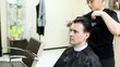 Video: Hairdresser cuts hair to man with long hair by scissors Hairdresser cuts hair to man with long hair by scissors