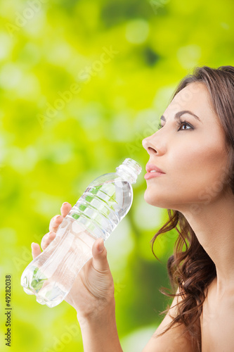Photo: Young woman drinking water, outdoor Young woman drinking water, outdoor