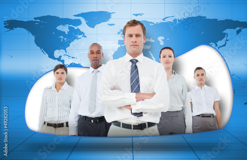 Photo: Business team on blue world map background Business team on blue world map background