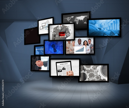 Photo: Many screens showing business images Many screens showing business images