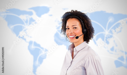 Photo: Smiling businesswoman wearing headset Smiling businesswoman wearing headset