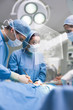 Photo: Concentred surgons operating with a touchscreen Concentred surgons operating with a touchscreen