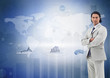 Businessman standing against the digital world map