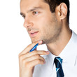 Portrait of thinking businessman, on white