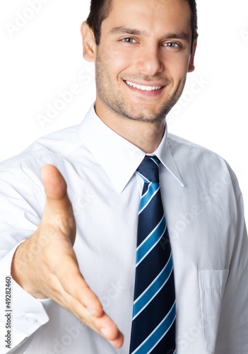 Photo: Business man giving hand for handshake, isolated Business man giving hand for handshake, isolated