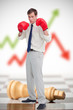 Photo: Businessman in boxing gloves on chessboard Businessman in boxing gloves on chessboard