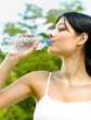 Portrait of woman drinking water outdoor