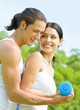 Cheerful couple with dumbbells on workout