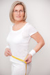 Photo: Seniorin with measuring tape Seniorin with measuring tape