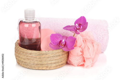 Photo: Cosmetics, towel and orchid flowers Cosmetics, towel and orchid flowers