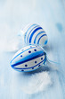 Photo: Blue easter eggs and white feathers Blue easter eggs and white feathers