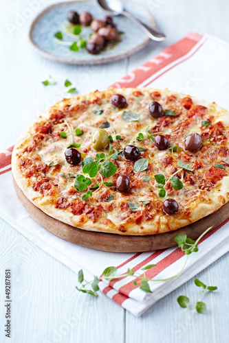 Photo: Pizza Margarita with olives and fresh oregano Pizza Margarita with olives and fresh oregano