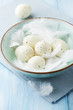 Photo: Bowl of spotted easter eggs and feathers Bowl of spotted easter eggs and feathers