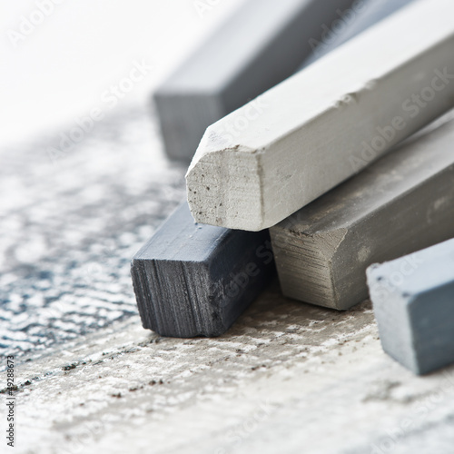 Photo: Close up of gray hard pastels Close up of gray hard pastels