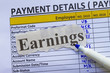 Payroll ledger  and pen, ready to pay emplyoees and taxes