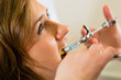 dentist holding a syringe