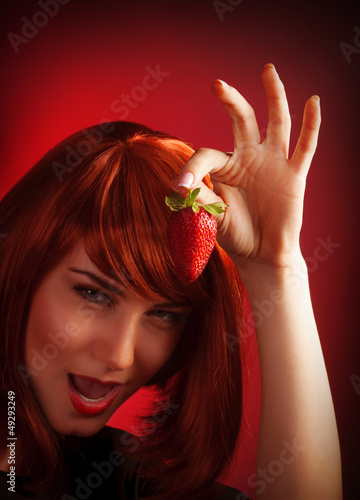 Photo: Female holding strawberry Female holding strawberry