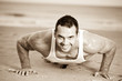 Male exercising on the beach