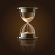 Sand falling in the hourglass.