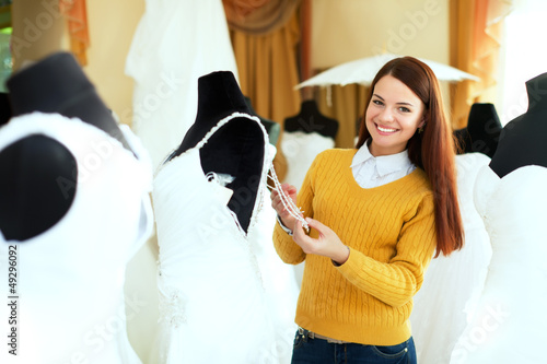 Photo: beautiful bride chooses bridal gown beautiful bride chooses bridal gown