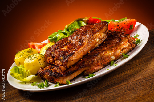 Photo: Tasty grilled ribs with vegetables Tasty grilled ribs with vegetables