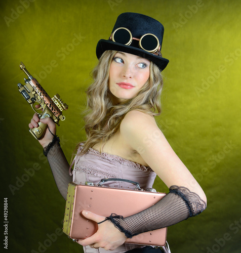 Photo: Steampunk woman with gun. Steampunk woman with gun.