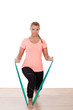 Woman working out with a strap
