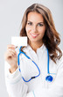 Young female doctor showing blank business card