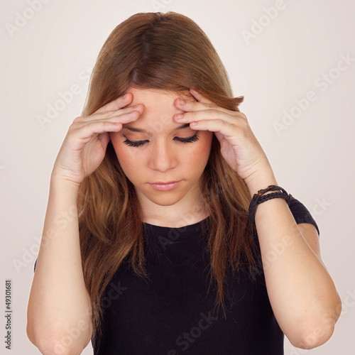 Photo: Teenager girl with migraine Teenager girl with migraine