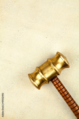 Photo: gavel on parchment paper gavel on parchment paper