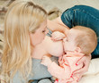 Mother breast feeding her infant