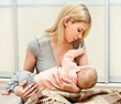 Mother breast feeding her infant