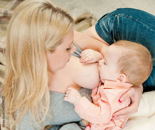 Photo: Mother breast feeding her infant Mother breast feeding her infant