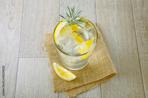 Photo: Glass of gin and tonic with ice and lemon Glass of gin and tonic with ice and lemon