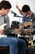 Rock group rehearsing