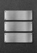 three stainless steel metal plates