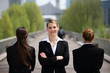 Three businesswomen stood on a bridge
