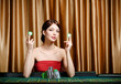 Photo: Woman with chips sitting at the casino table Woman with chips sitting at the casino table