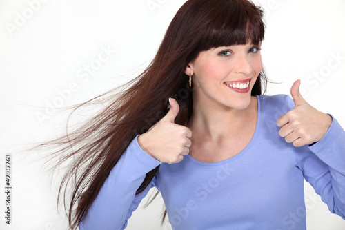 Photo: Attractive woman giving two thumbs up Attractive woman giving two thumbs up