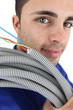 Electrician with a reel of wires