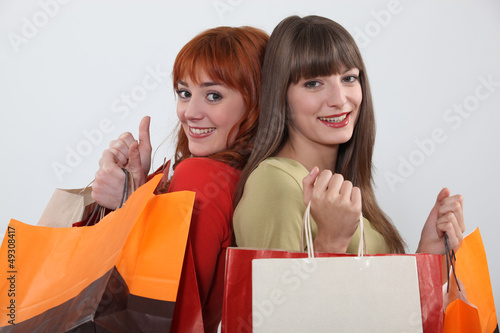 Photo: Two friends with shopping bags Two friends with shopping bags