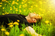 Photo: man lying on grass at sunny day man lying on grass at sunny day