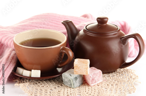 Photo: cup of tea with scarf isolated on white cup of tea with scarf isolated on white