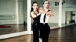 Montage of professional dancers dancing tango in ballroom