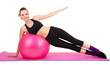 Young woman doing fitness exercises with gym ball isolated