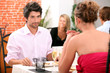 Photo: Couple dining in restaurant Couple dining in restaurant